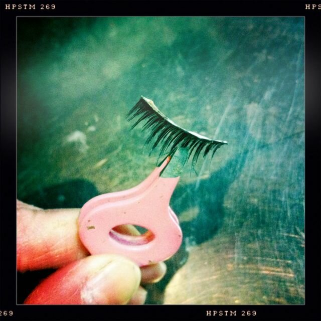 Use tweezers to grip & allow glue to "set" for a minute. Makes it tacky & stay where you place.